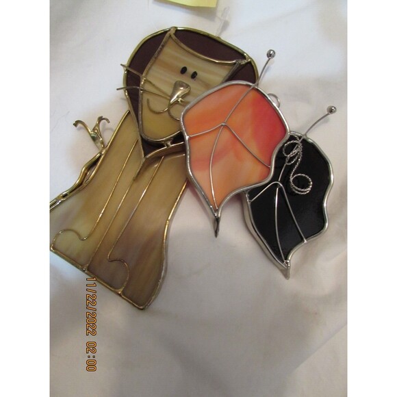 Stained glass leaves and lion handmade ornaments hang in window - Picture 7 of 7